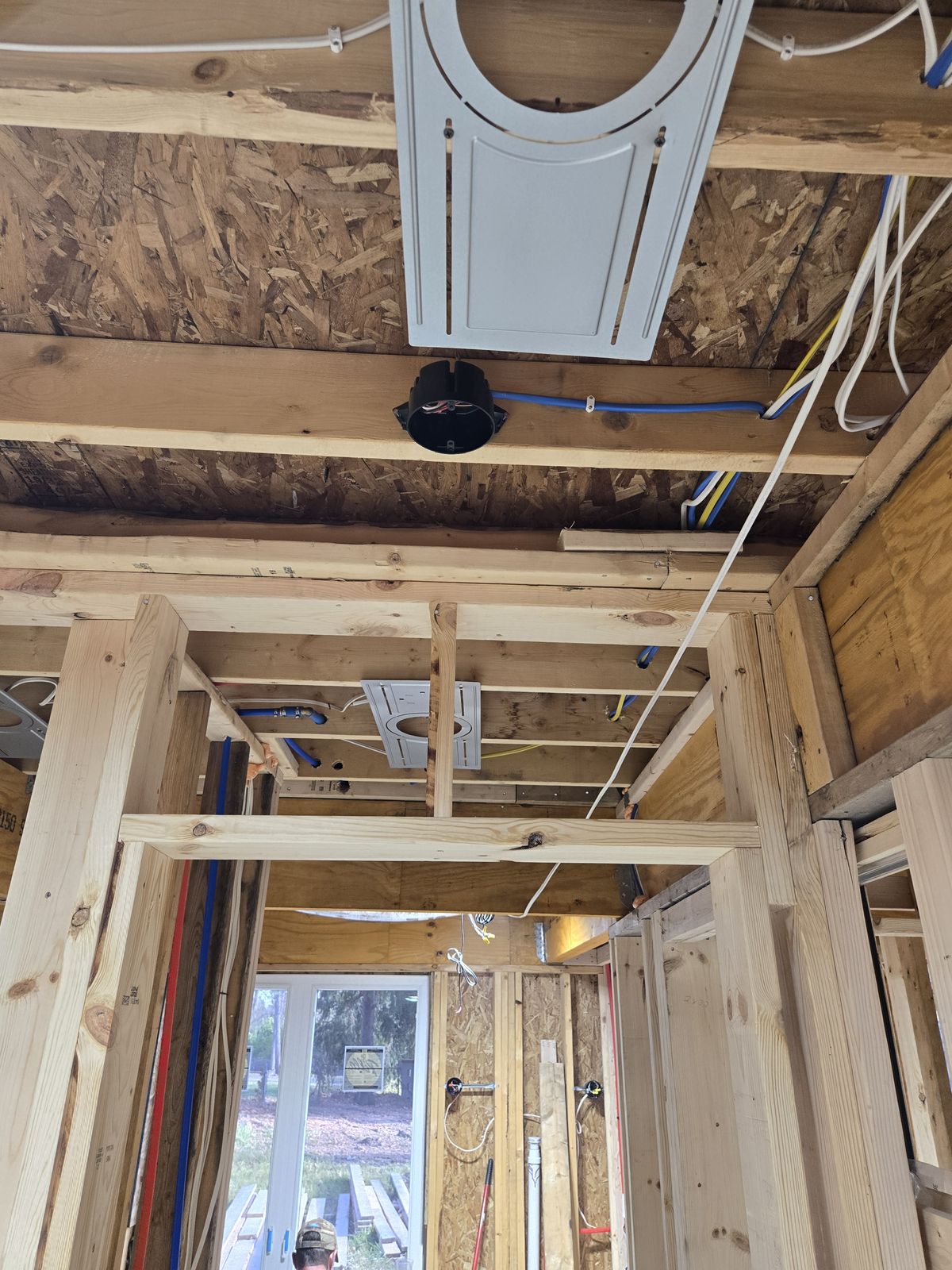 Rough-in wiring and ceiling boxes in a new home