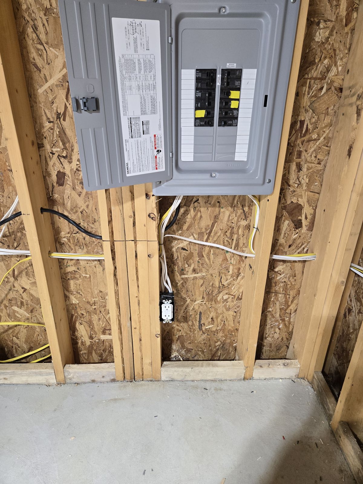 New breaker panel installed in a framed wall